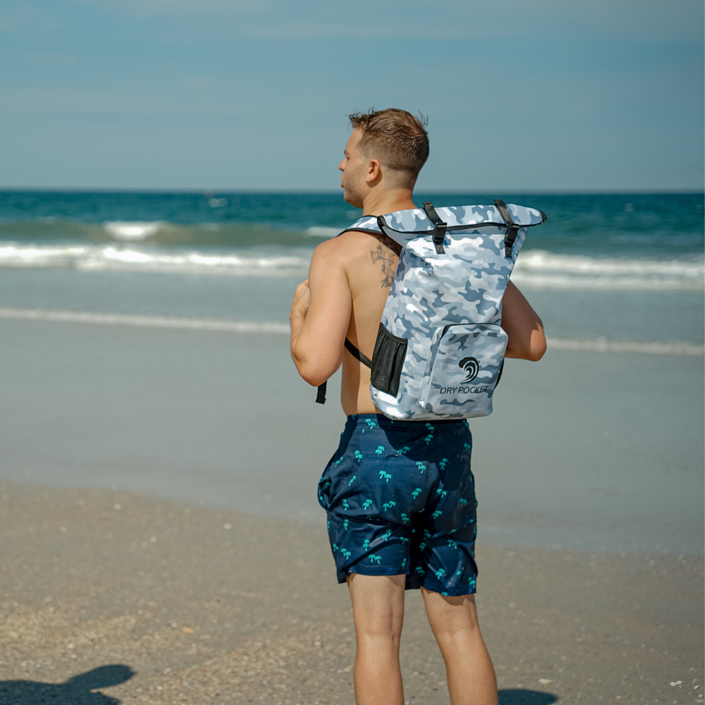 Dry Pocket - Waterproof Floating Backpack Dry Bag - Snow Camo - model wearing backpack from back