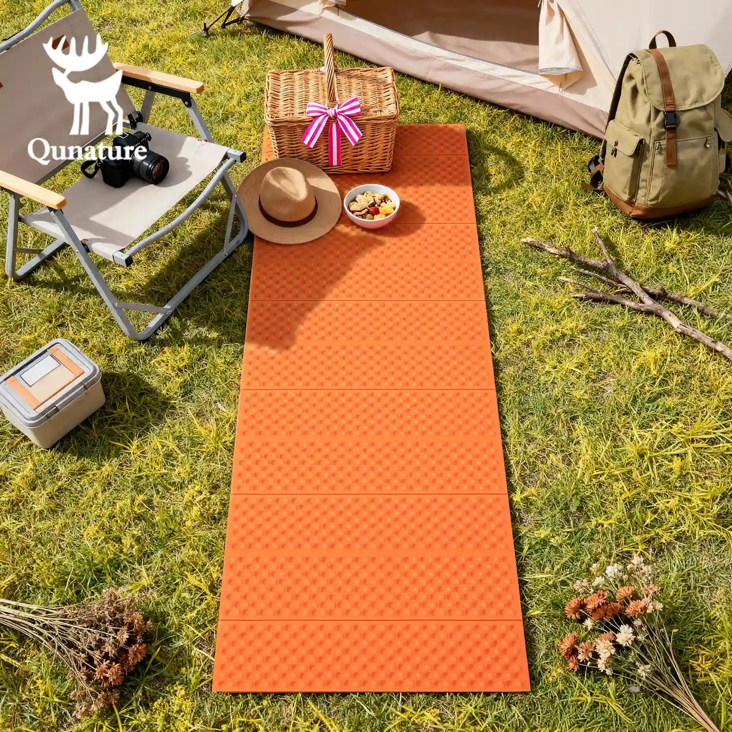 Qunature Global - Ultralight Folding Sleeping Pad Waterproof R-Value 1.8 for Camping & Hiking - Sleeping pad laid out in front of a tent at a campsite