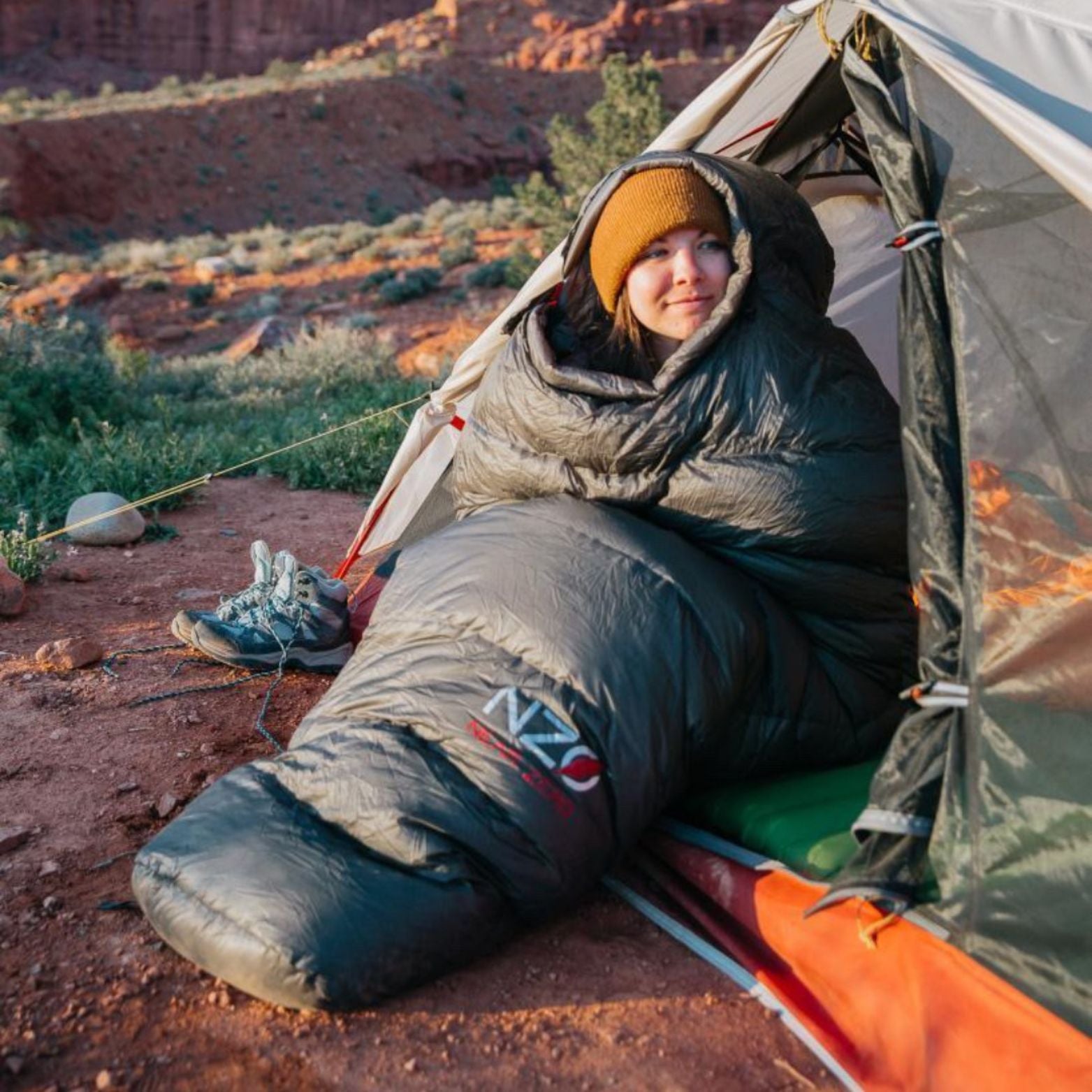 Near Zero Outdoor Gear - NZ 20 Mummy Sleeping Bag - Woman wrapped up in sleeping bag