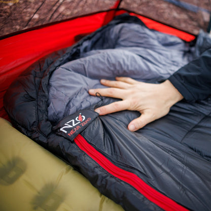 Near Zero Outdoor Gear - Peralta 25 Synthetic Sleeping Bag - Sleeping bag being laid out on a sleeping pad inside a tent