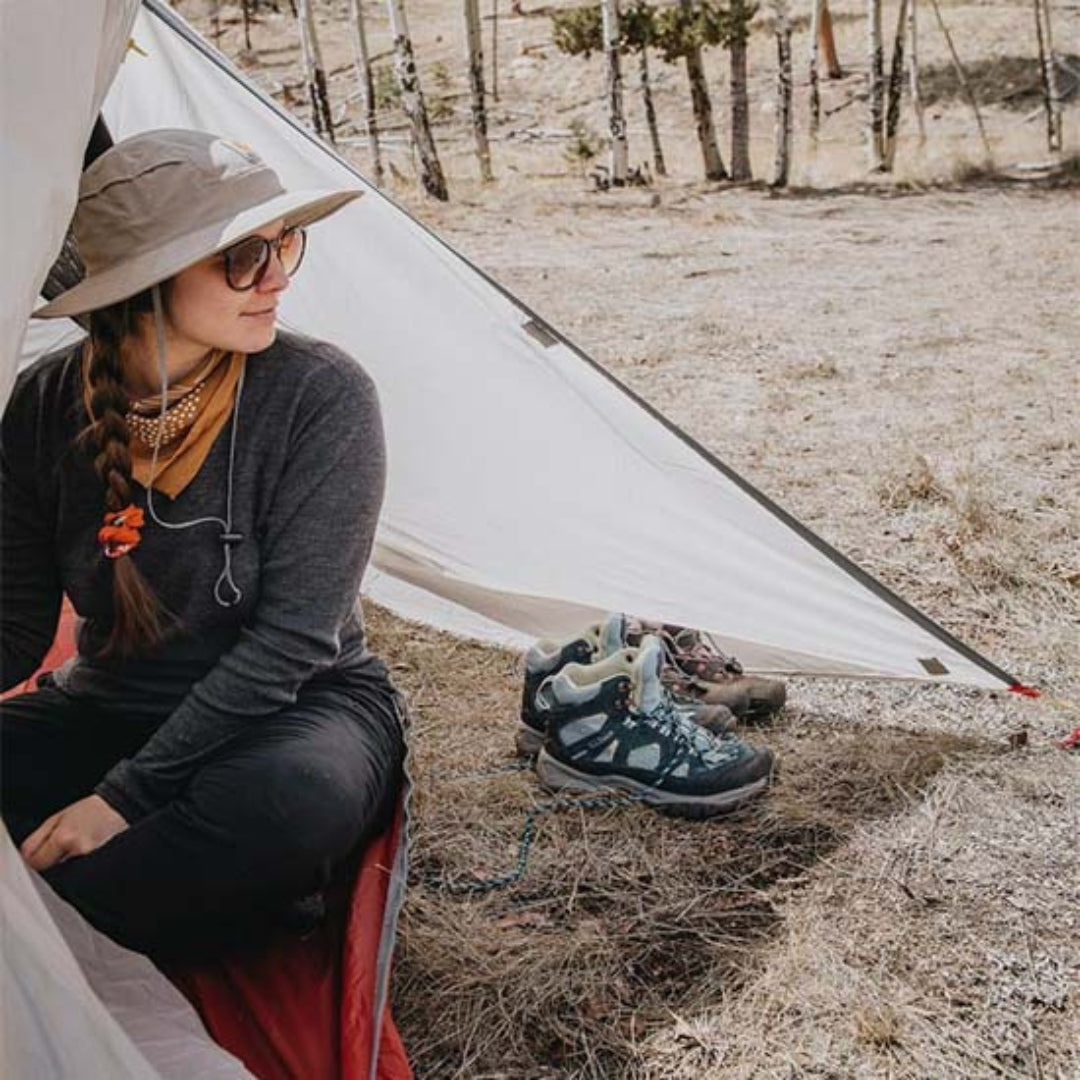 Near Zero Outdoor Gear - 3P DynaLite Tent - Woman sitting in tent vestibule