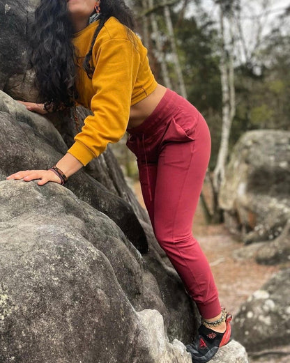 Soul Fire Apparel Co - Onsight Joggers - Woman climbing on boulders - Maple Red