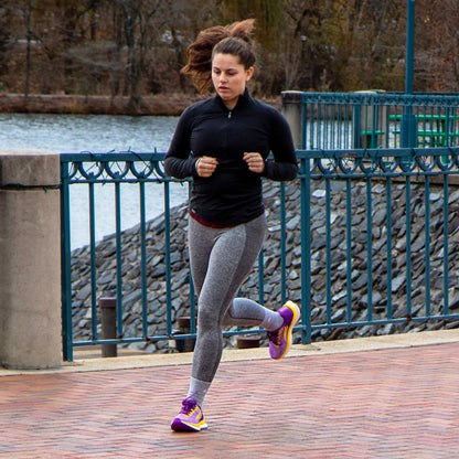 Swift Running - EQUUS Women - Purple - Woman running on sidewalk