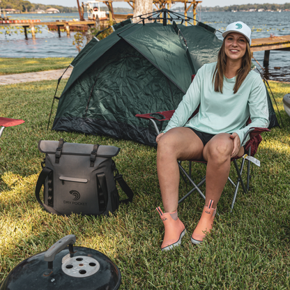Dry Pocket - Waterproof Floating Cooler Tote - Dark Grey - Woman relaxing at campsite with bag