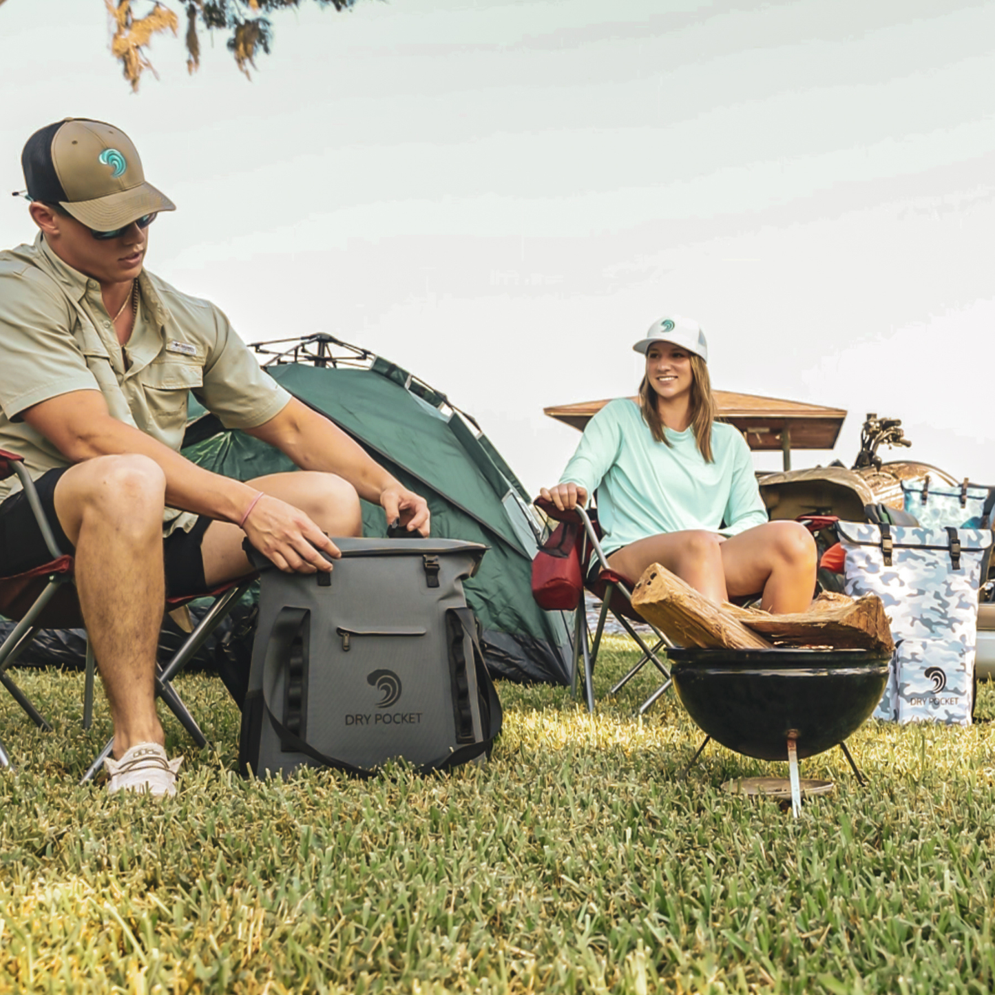 Dry Pocket - Waterproof Floating Cooler Tote - Dark Grey - Man and women using bag at camp