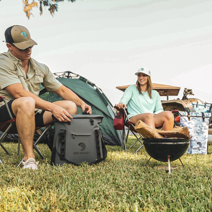 Dry Pocket - Waterproof Floating Cooler Tote - Dark Grey - Man and women using bag at camp