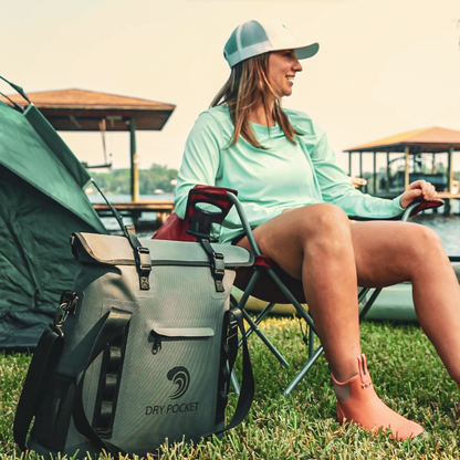 Dry Pocket - Waterproof Floating Cooler Tote - Dark Grey - Woman relaxing at campsite with bag
