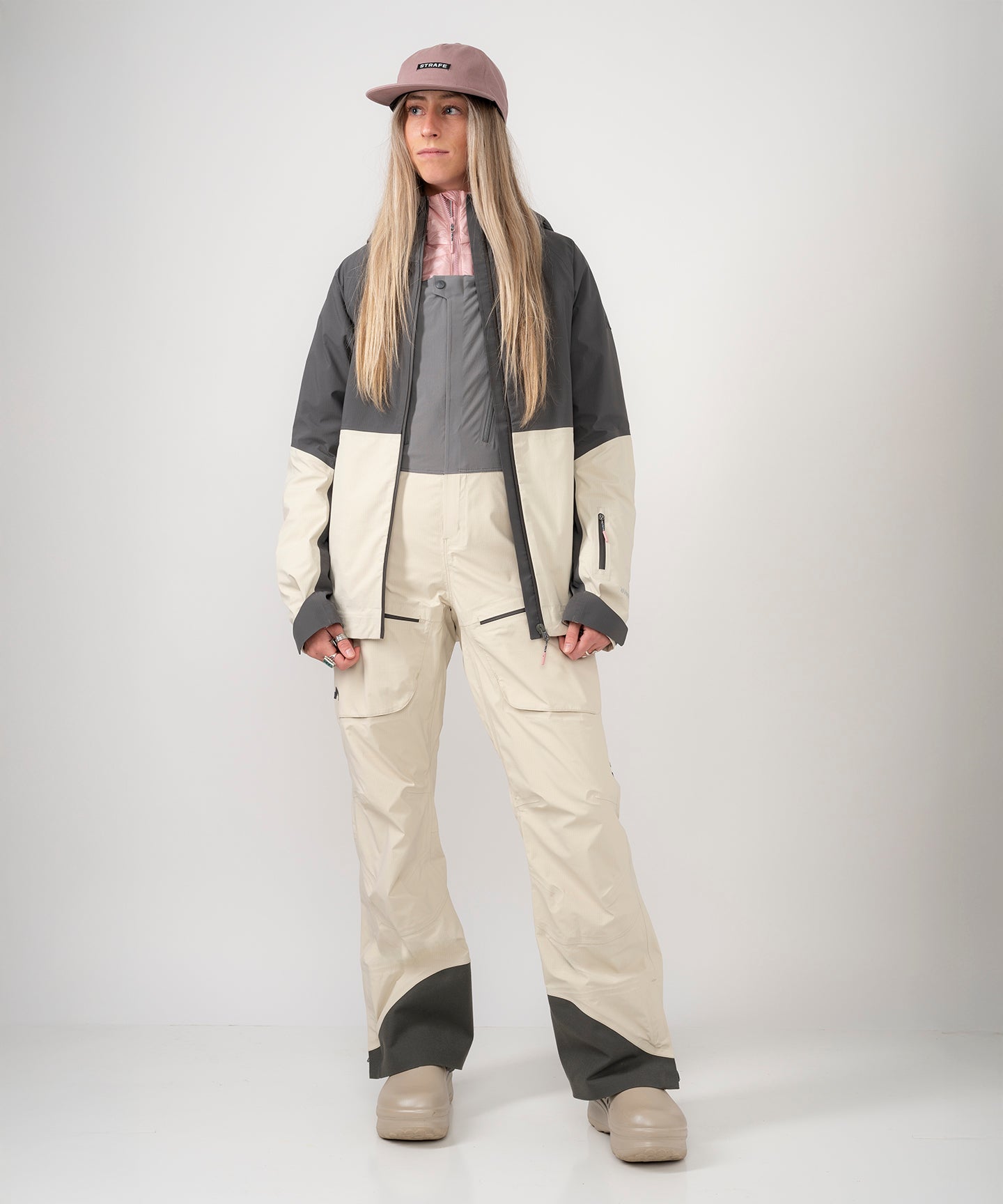 Strafe Outerwear - Meadow 3L Shell Jacket - Woman wearing jacket, front left - Light Khaki