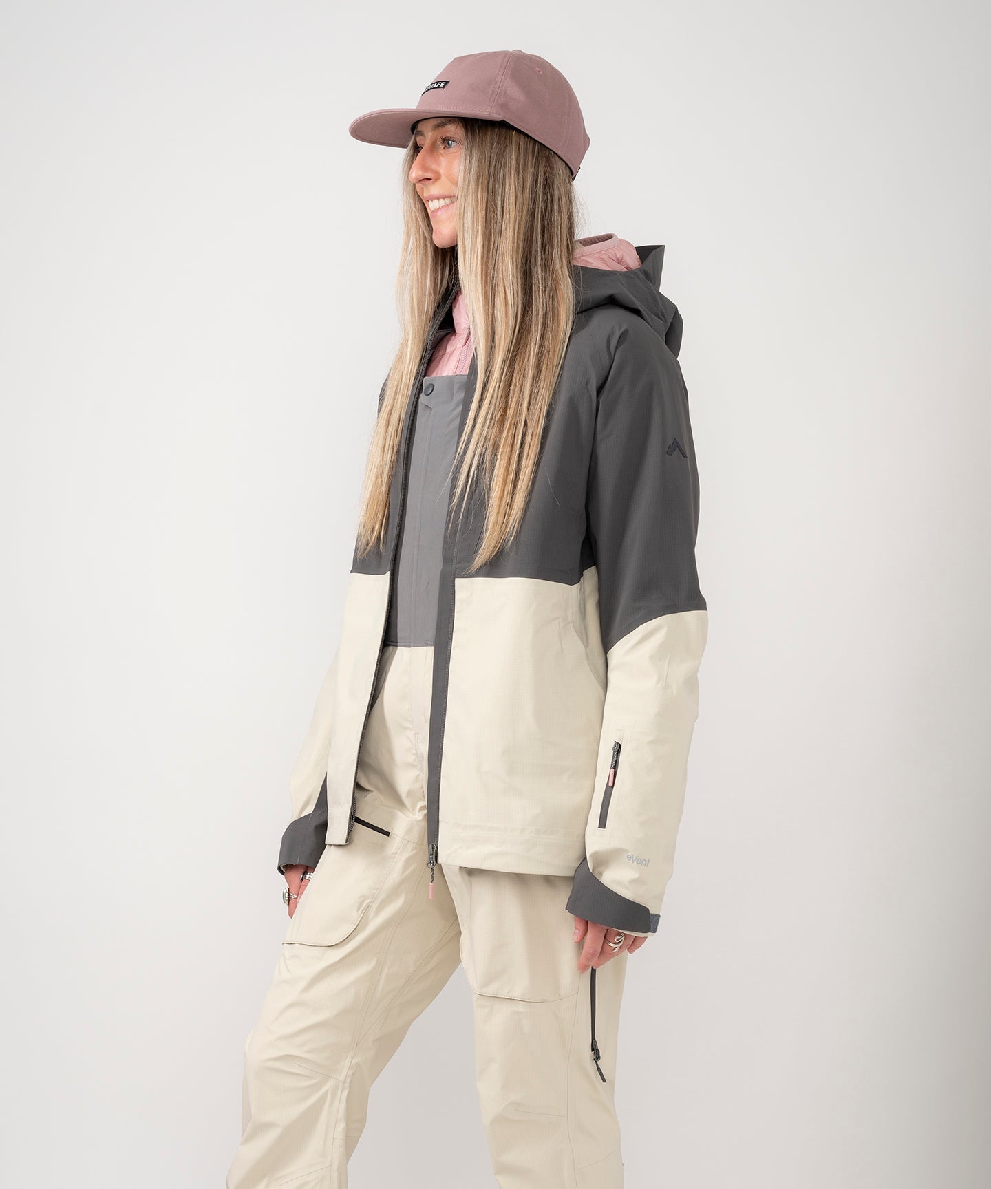 Strafe Outerwear - Meadow 3L Shell Jacket - Woman wearing jacket, front left side - Light Khaki