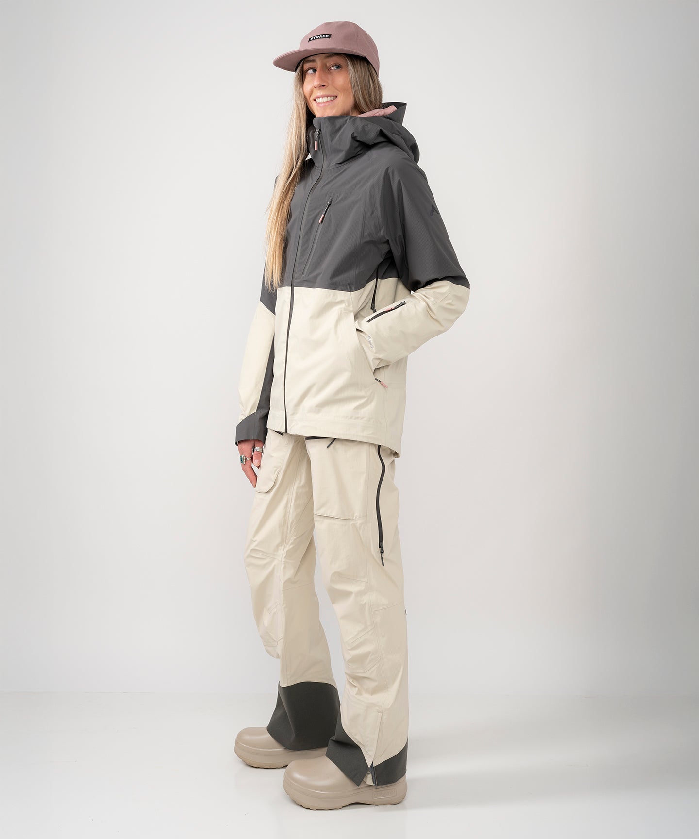Strafe Outerwear - Meadow 3L Shell Jacket - Woman wearing jacket, front left side - Light Khaki