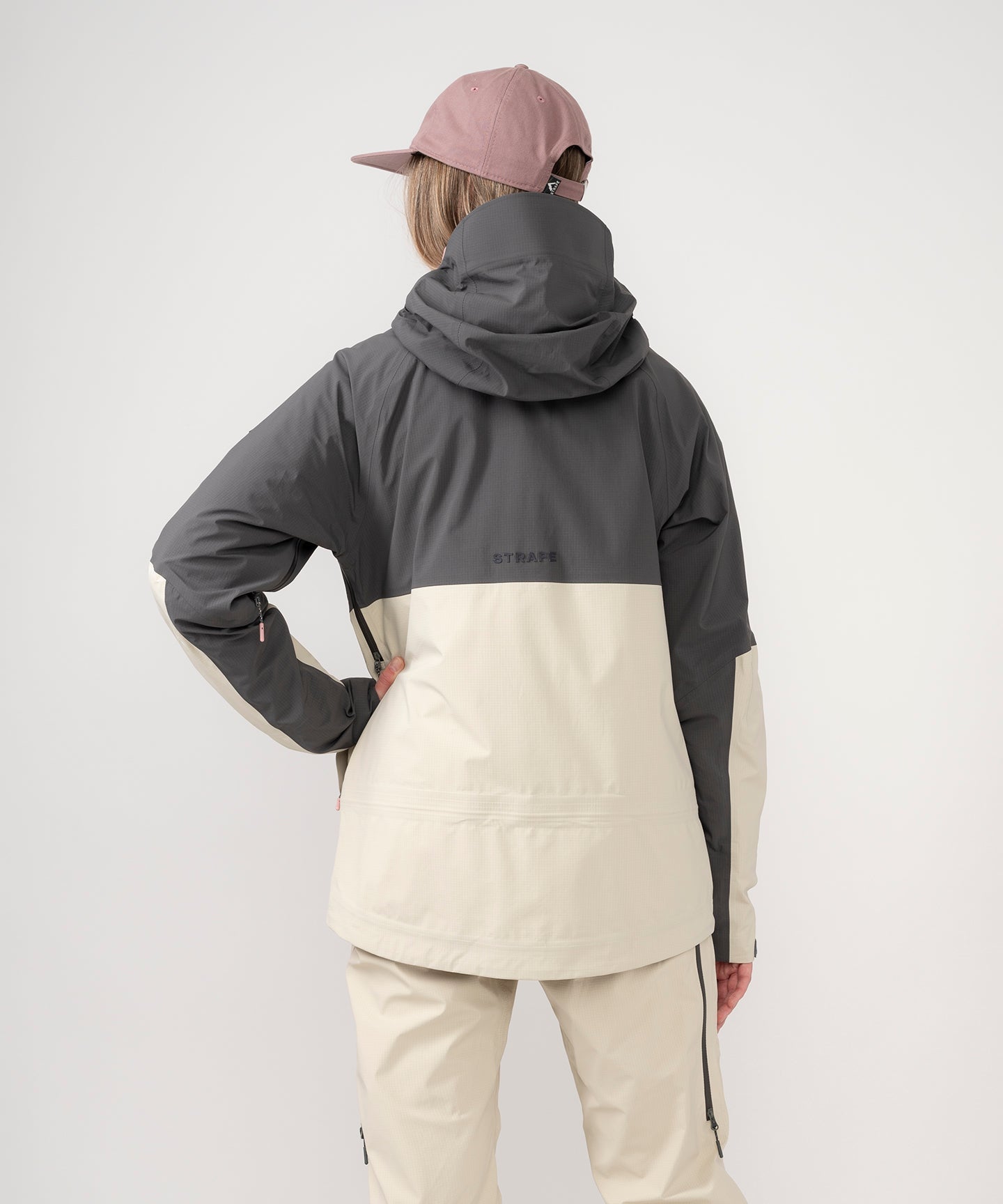 Strafe Outerwear - Meadow 3L Shell Jacket - Woman wearing jacket, back - Light Khaki