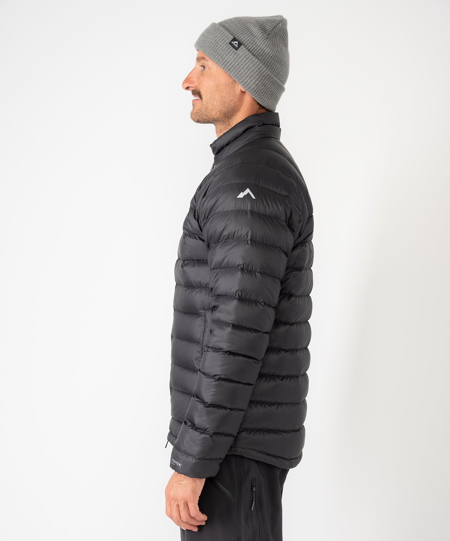 Strafe Outerwear - Palisade Down Insulator Jacket - Man wearing jacket, left side - Black