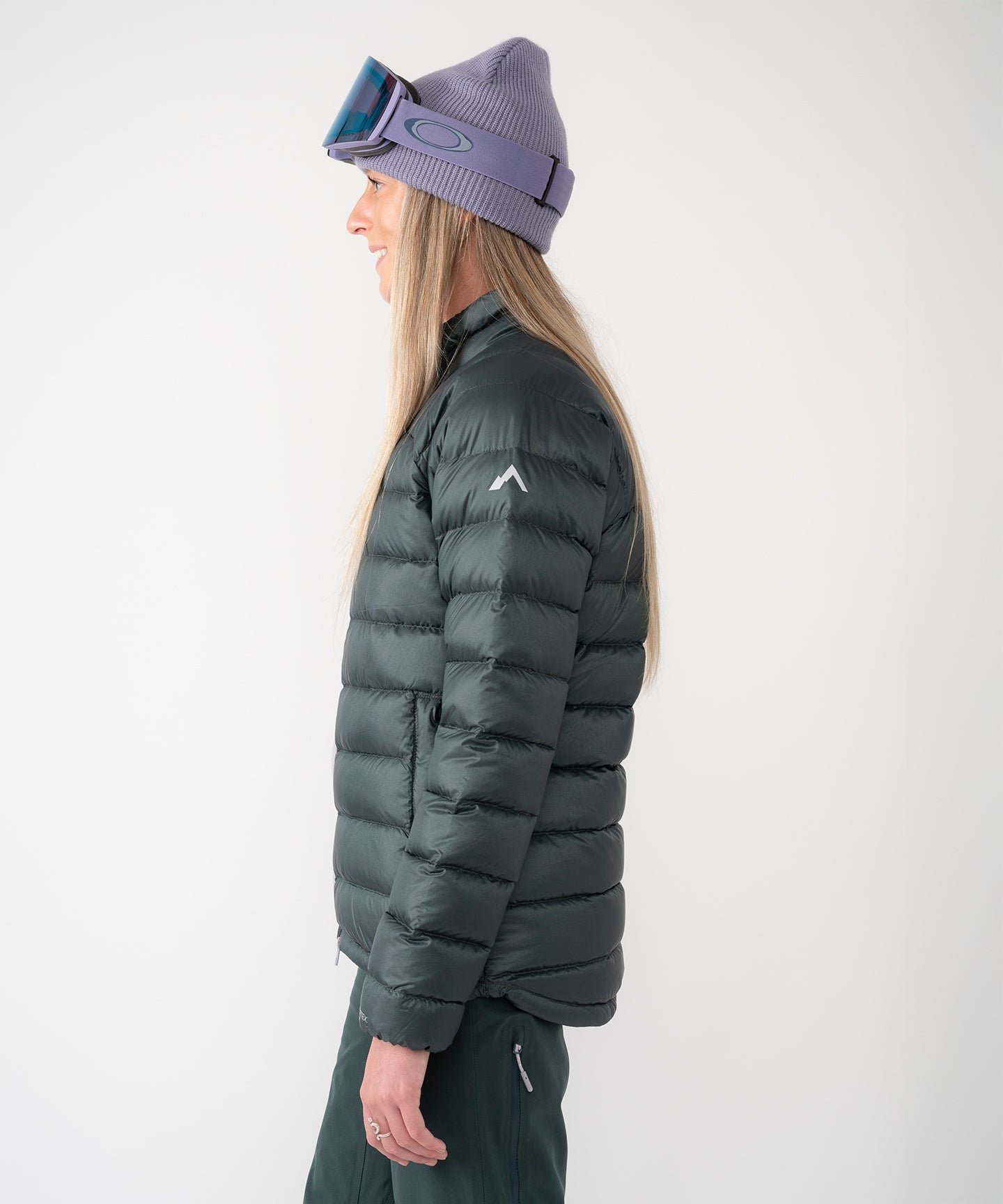 Strafe Outerwear - Palisade Down Insulator Jacket - Woman wearing puffy jacke, left side - Deep Forest