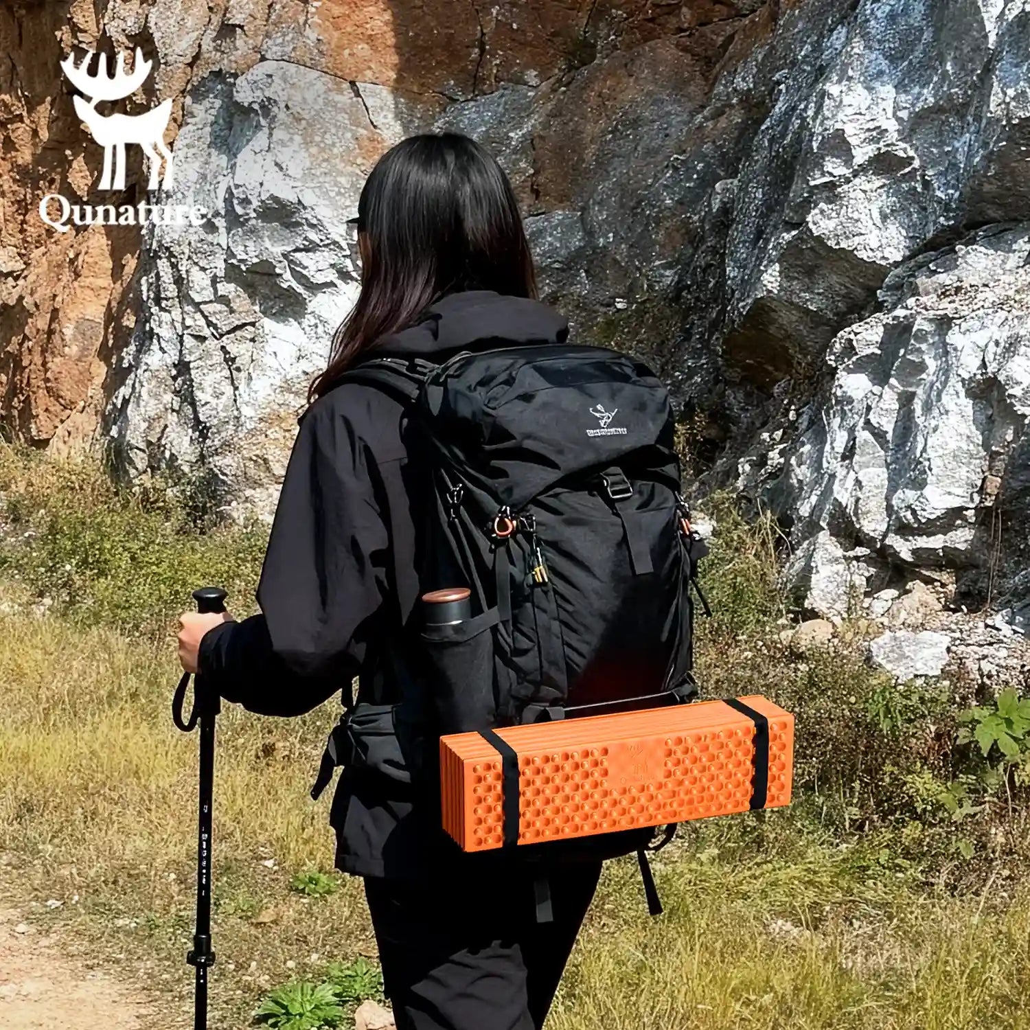 Qunature Global - Ultralight Folding Sleeping Pad Waterproof R-Value 1.8 for Camping & Hiking - Woman hiking with sleeping pad strapped to backpack
