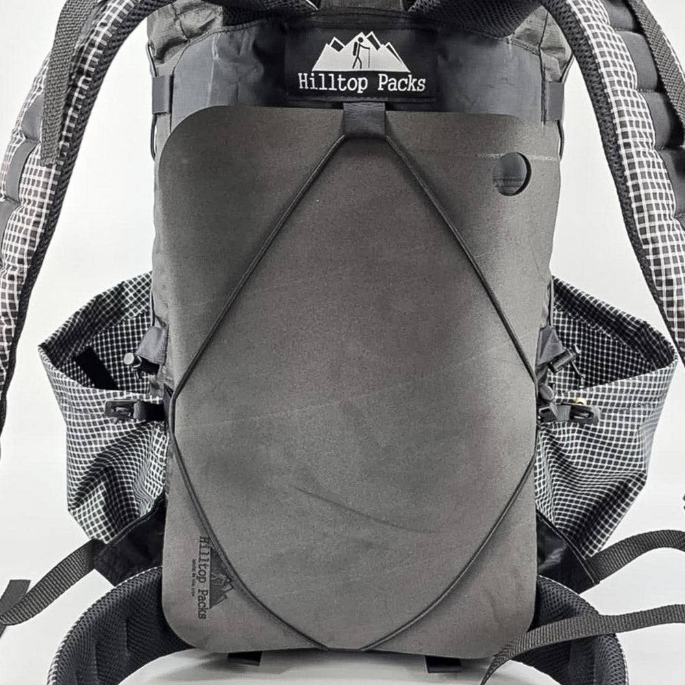 Hilltop Packs LLC - Ultralight Sit Pad - Black sit pad stowed on backpack