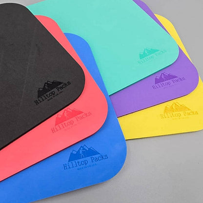 Hilltop Packs LLC - Ultralight Sit Pad - Branding details on a variety of different colored sit pads