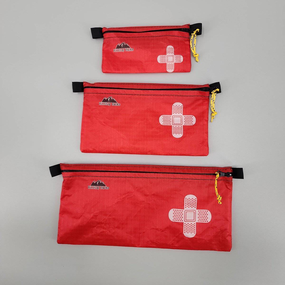 Hilltop Packs LLC - Ultralight Zipper Pouches - Classic Patterns - Challenge D50T Fabric - Red med kit 3, small medium & large